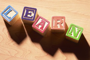 image of wooden blocks spelling learn