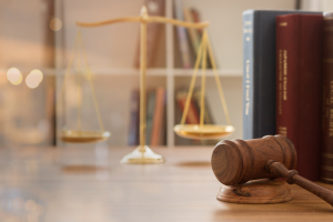 image of judge's gavel with scales of justice in the background