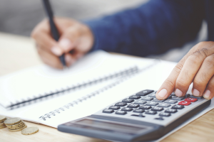 Image of a man working on a financial statement