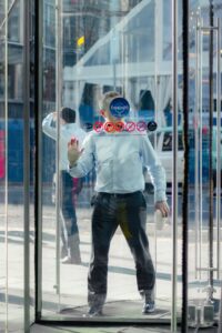 employee entering business through revolving door