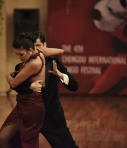 couple dancing the tango in a ballroom