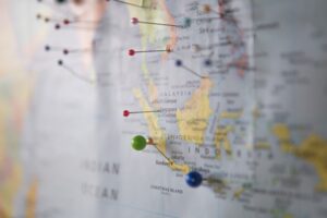 Image of a world map with pins in several locations